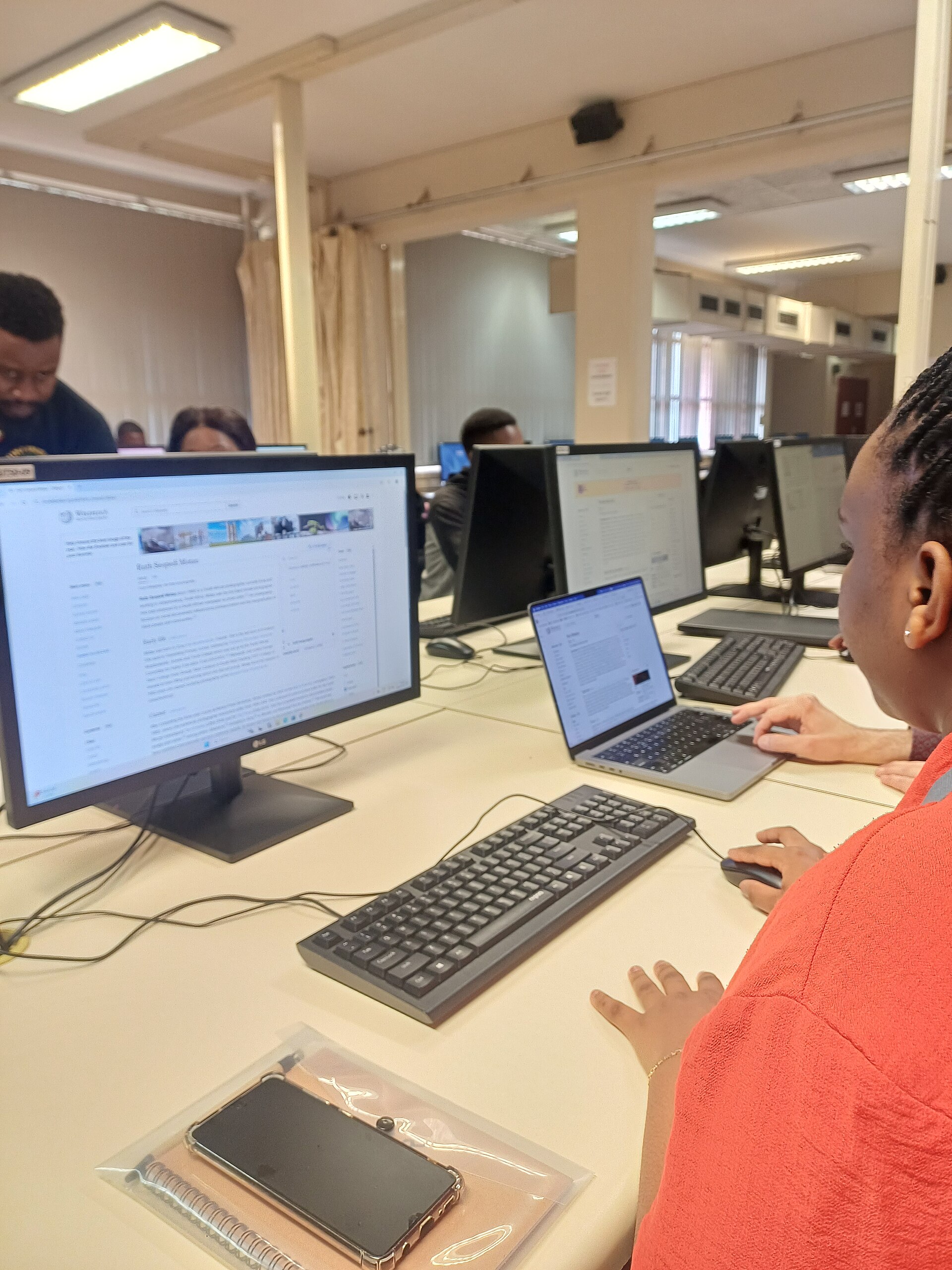 Learner using a desktop computer for digital skills practice